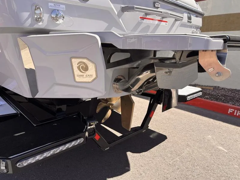 Slide: The Image of 2025 Malibu 23 LSV boat stern with propeller and surf gate system. - 5