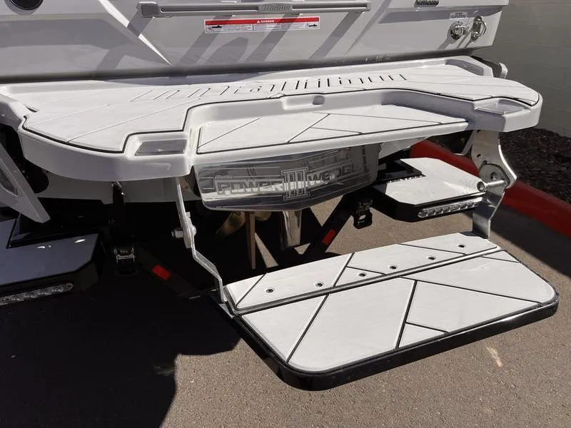 Slide: The Image of 2025 Malibu 23 LSV boat swim platform with Power Wedge III feature. - 6