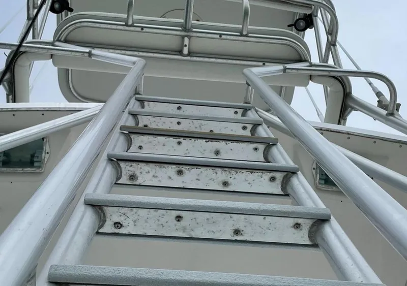 Slide: The Image of Staircase on a 1995 Bertram Convertible boat, leading to the upper deck. - 16