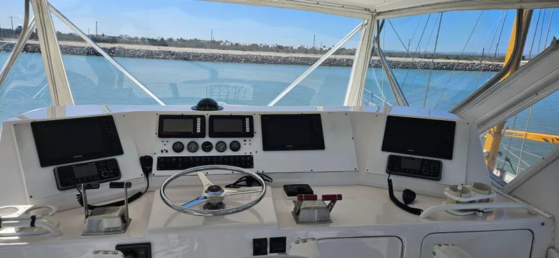 Slide: The Image of 1995 Bertram Convertible yacht helm with navigation equipment and ocean view. - 24