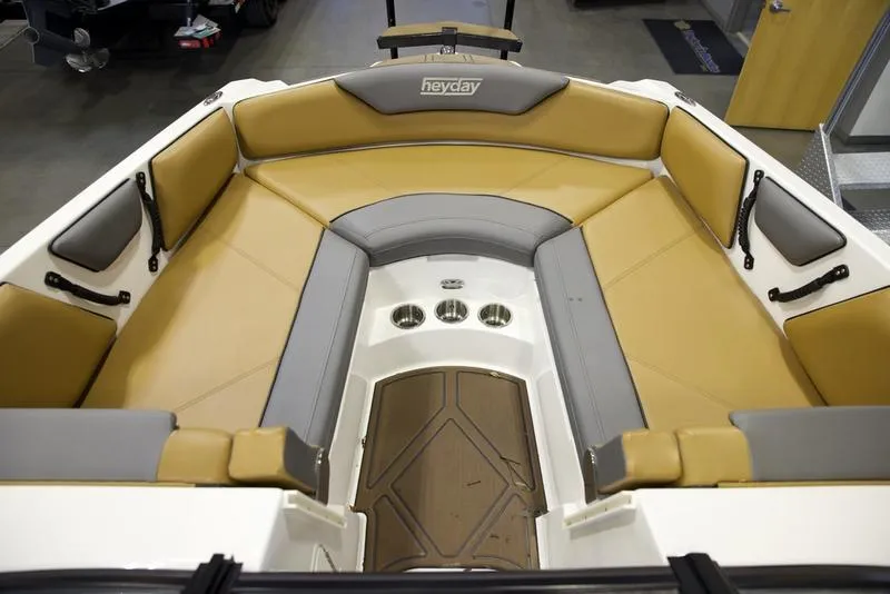 Slide: The Image of 2023 Heyday WTSurf boat interior with tan and gray seating. - 12
