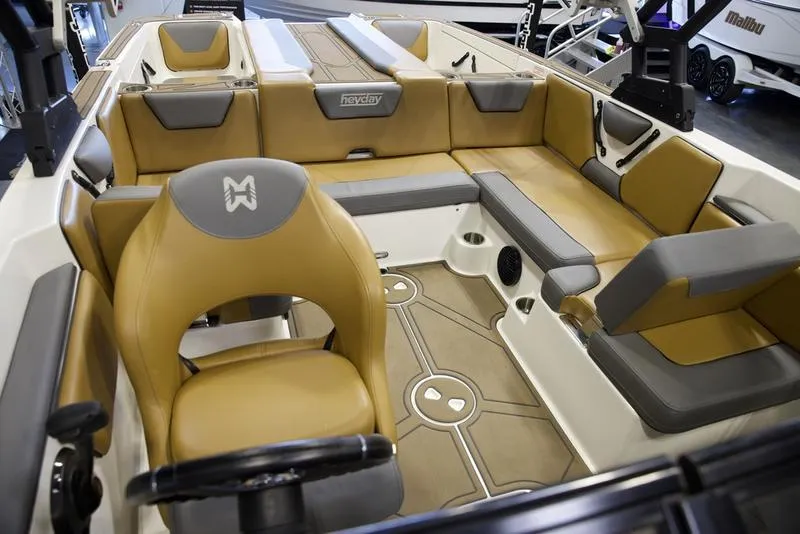Slide: The Image of 2023 Heyday WTSurf boat interior with tan and gray seating, showcasing modern design. - 15