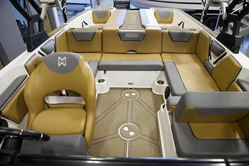 Slide: The Image of 2023 Heyday WTSurf boat interior with tan and gray seating. - 16