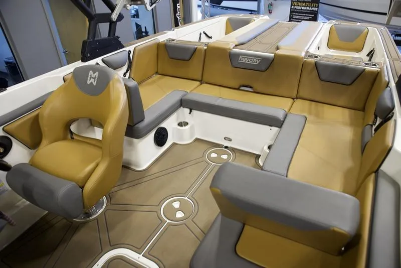 Slide: The Image of 2023 Heyday WTSurf boat interior with tan and gray seating. - 17