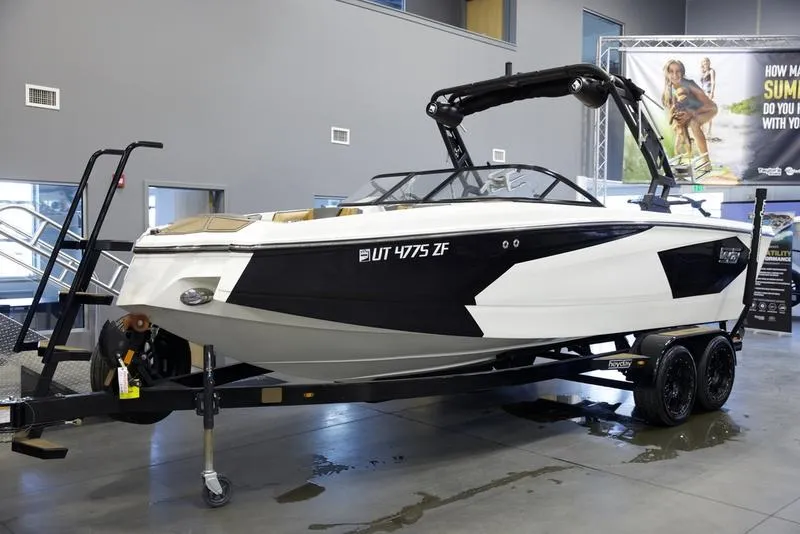 Slide: The Image of 2023 Heyday WTSurf boat on trailer in showroom setting. - 3