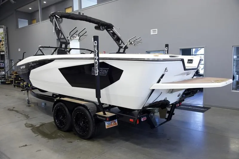 Slide: The Image of 2023 Heyday WTSurf boat on trailer in showroom, rear view. - 4