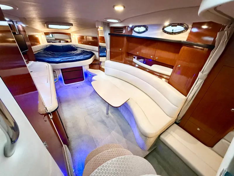 Slide: The Image of Luxurious interior of 2004 Sea Ray 340 Sundancer yacht with elegant seating and ambient lighting. - 16