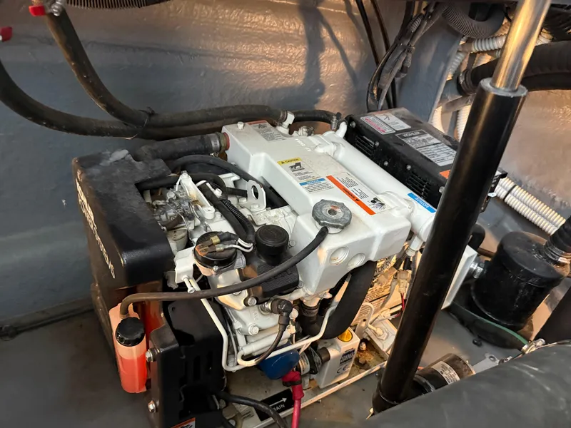 Slide: The Image of Engine compartment of a 2004 Sea Ray 340 Sundancer boat, showing detailed components. - 30