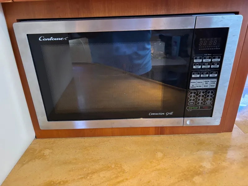 Slide: The Image of Built-in microwave oven in a 2010 Regal 44 Sport Coupe kitchen. - 31