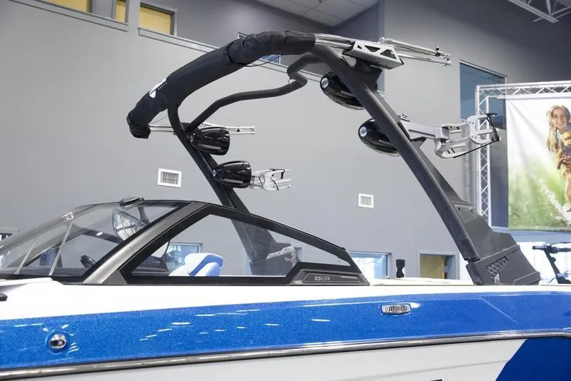 Slide: The Image of 2024 Malibu 23 LSV boat with sleek design and advanced wakeboard tower. - 10