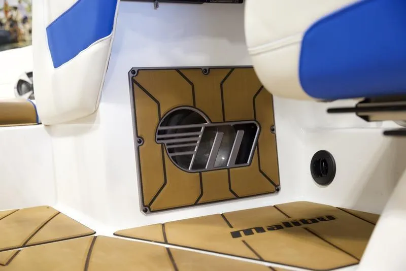 Slide: The Image of 2024 Malibu 23 LSV interior detail with blue and white seating and custom flooring. - 14