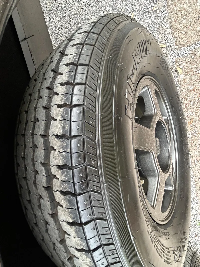 Slide: The Image of 2008 Ranger Z21 tire with black alloy wheel on asphalt surface. - 34