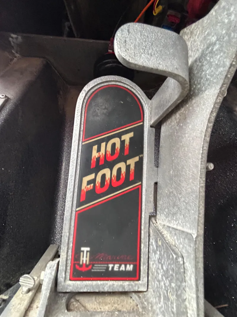 Slide: The Image of Hot Foot pedal in a 2008 Ranger Z21 boat, featuring a textured design. - 36