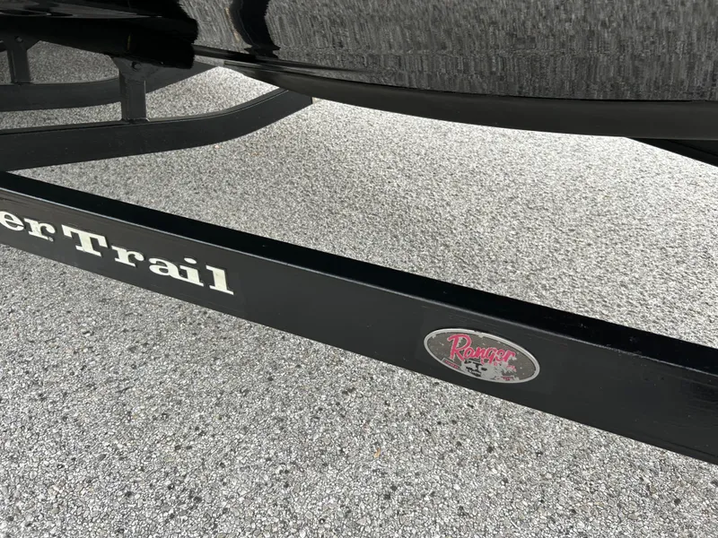 Slide: The Image of Trailer frame of a 2008 Ranger Z21 boat on pavement. - 45
