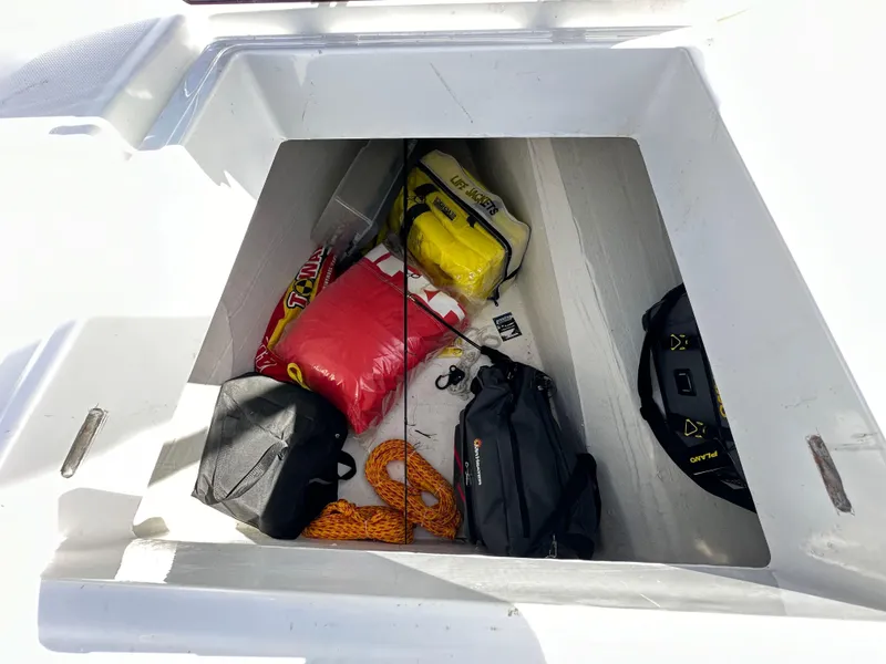 Slide: The Image of Storage compartment of 2023 Bali 4.2 boat with bags and equipment. - 25