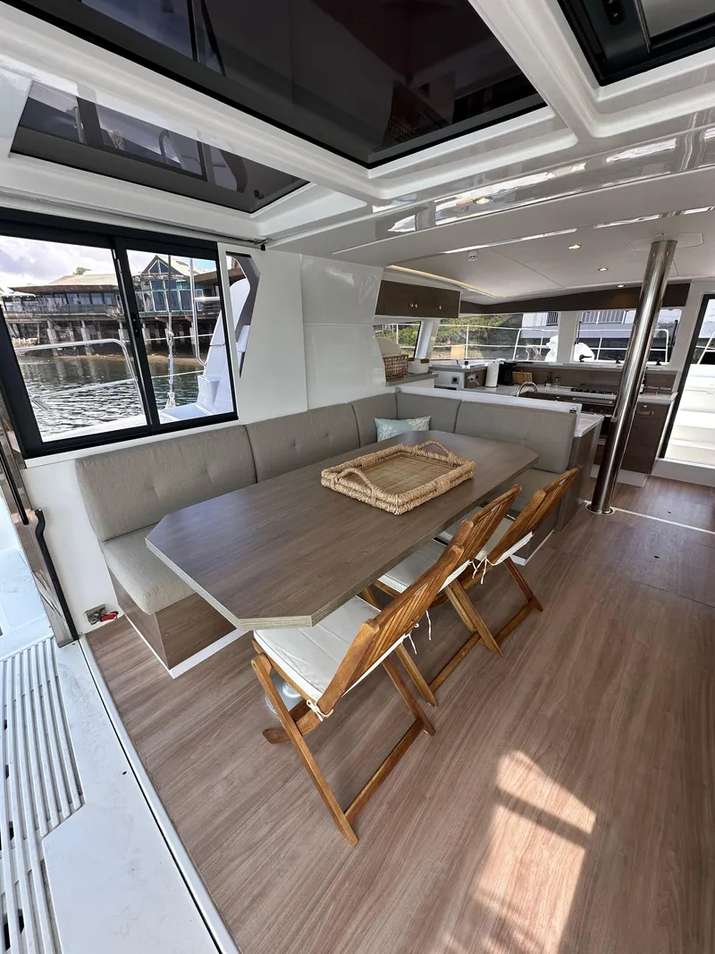 Slide: The Image of Interior of 2023 Bali 4.2 yacht with dining area and modern furnishings. - 40