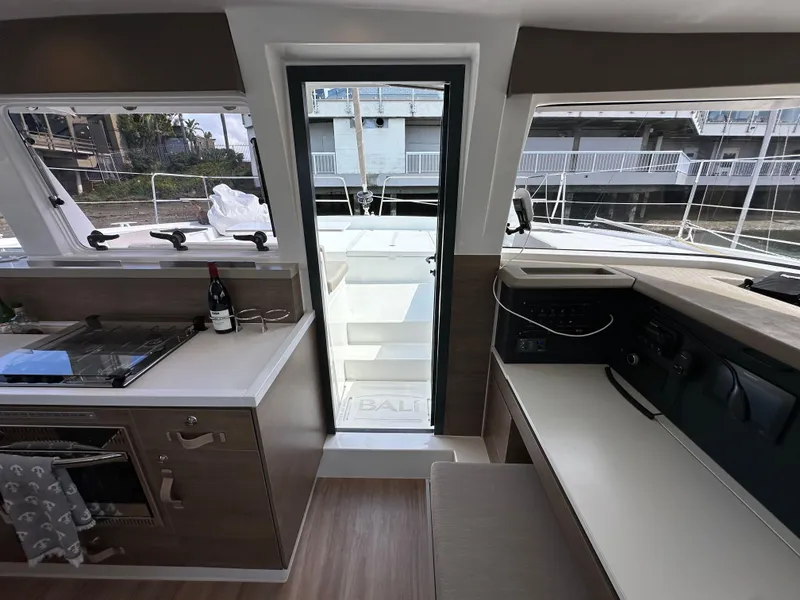 Slide: The Image of Interior of 2023 Bali 4.2 yacht, featuring modern kitchen and navigation area. - 48