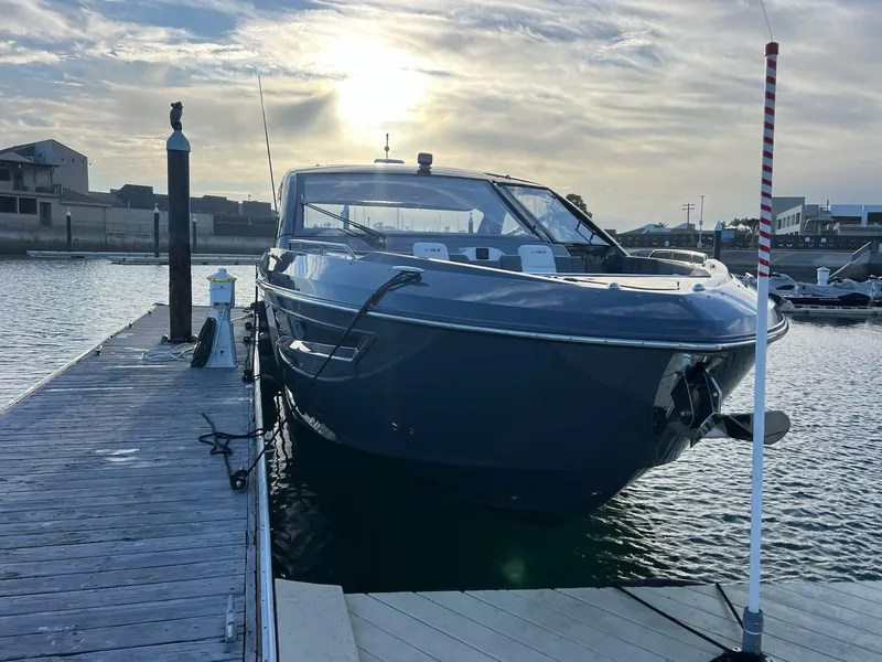 Slide: The Image of 2023 Cruisers Yachts 42 GLS docked at marina during sunset. - 11
