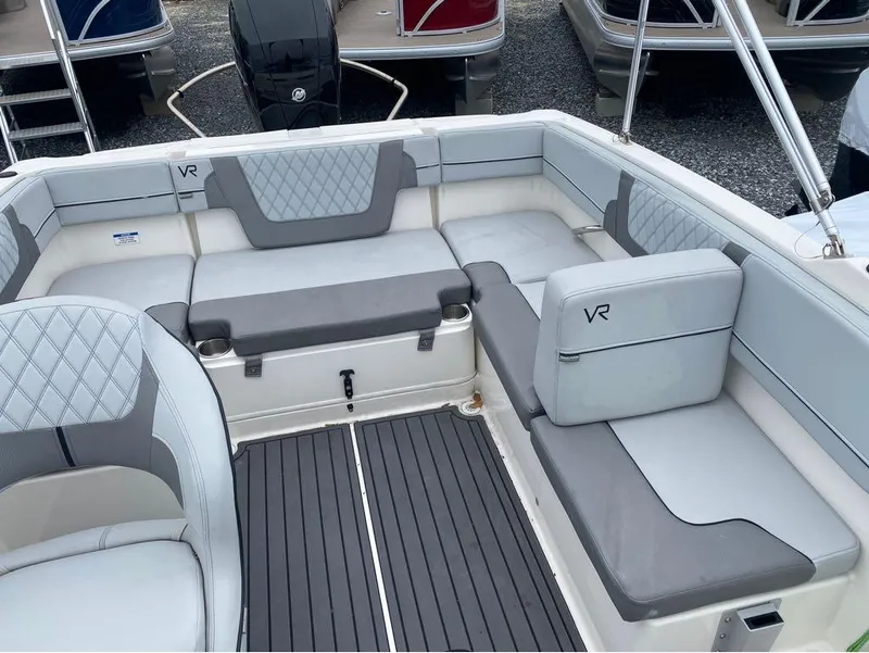Slide: The Image of 2023 Bayliner VR4 Bowrider interior with gray seating and modern design. - 6