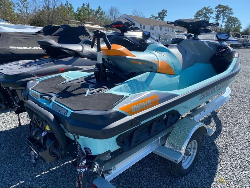 Slide: The Image of 2022 Sea-Doo RXT-X 300 and Wake Pro jet skis on a trailer. - 4