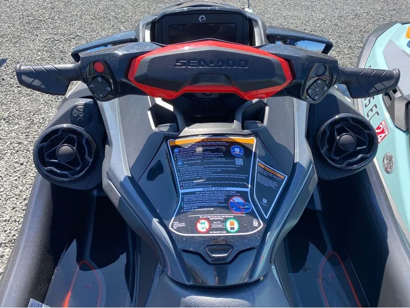 Slide: The Image of 2022 Sea-Doo RXT-X 300 Premium Triple Black dashboard with sound system controls. - 5