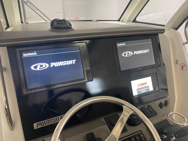Slide: The Image of 2019 Pursuit S 328 Sport dashboard with Garmin displays and Yamaha controls. - 16