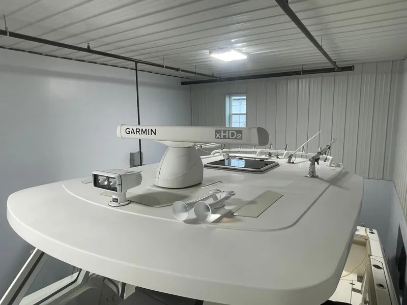 Slide: The Image of 2019 Pursuit S 328 Sport boat with Garmin xHD2 radar in a storage facility. - 4