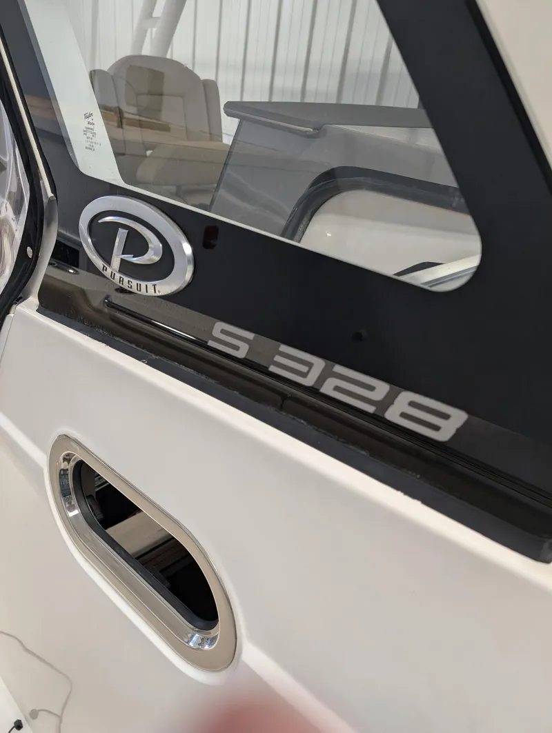 Slide: The Image of 2019 Pursuit S 328 Sport boat detail with logo and model name. - 6