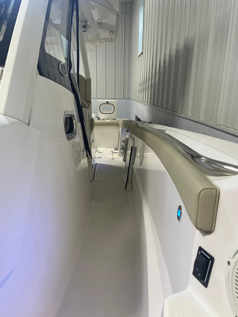 Slide: The Image of 2019 Pursuit S 328 Sport boat interior with sleek design and modern features. - 9