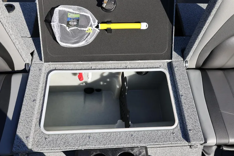 Slide: The Image of 2025 Lund 1875 Impact XS Sport boat storage compartment with fishing net and accessories. - 18