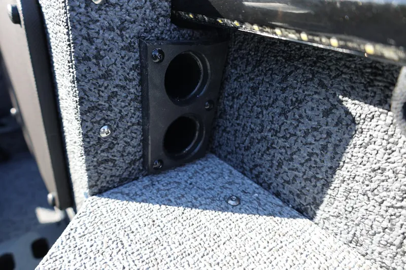 Slide: The Image of 2025 Lund 1875 Impact XS Sport interior detail with dual cup holders. - 21