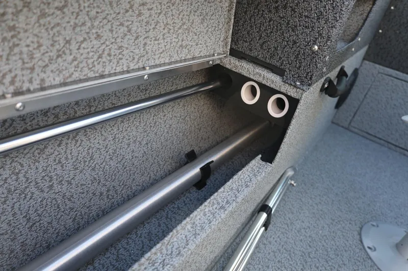 Slide: The Image of 2025 Lund 1875 Impact XS Sport interior rod storage compartment, featuring durable construction. - 24