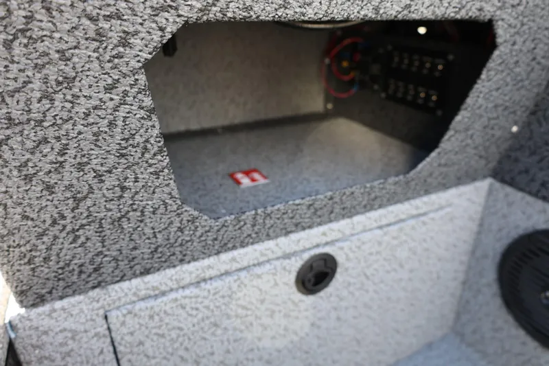 Slide: The Image of Interior storage compartment of 2025 Lund 1875 Impact XS Sport boat. - 26
