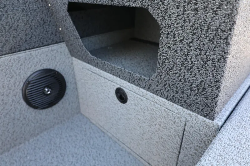 Slide: The Image of 2025 Lund 1875 Impact XS Sport interior with speaker and storage compartment. - 27