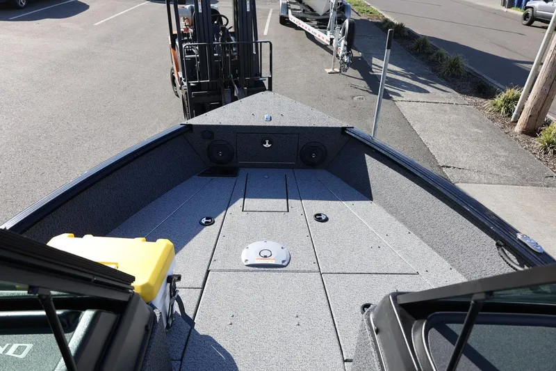 Slide: The Image of 2025 Lund 1875 Impact XS Sport boat deck, featuring spacious layout and modern design. - 28