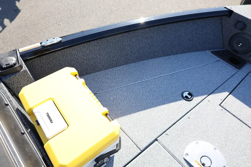 Slide: The Image of 2025 Lund 1875 Impact XS Sport boat interior with yellow storage box. - 30