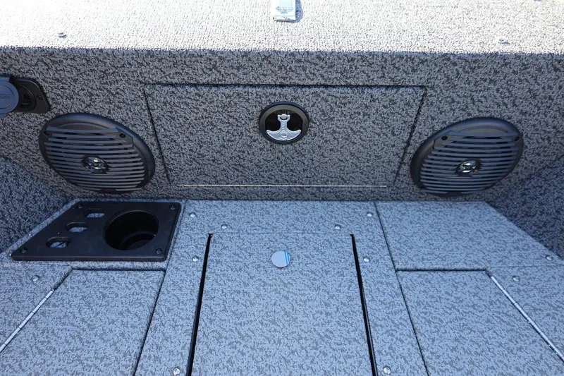 Slide: The Image of 2025 Lund 1875 Impact XS Sport boat interior with speakers and storage compartments. - 32