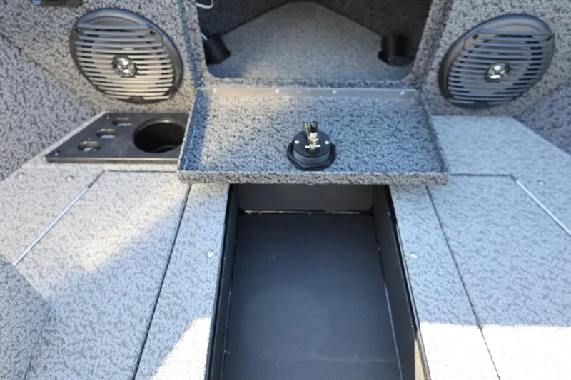 Slide: The Image of 2025 Lund 1875 Impact XS Sport boat interior with speakers and storage compartment. - 33