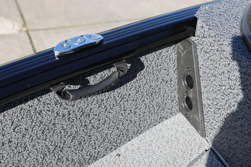 Slide: The Image of 2025 Lund 1875 Impact XS Sport interior detail with textured finish and handle. - 36