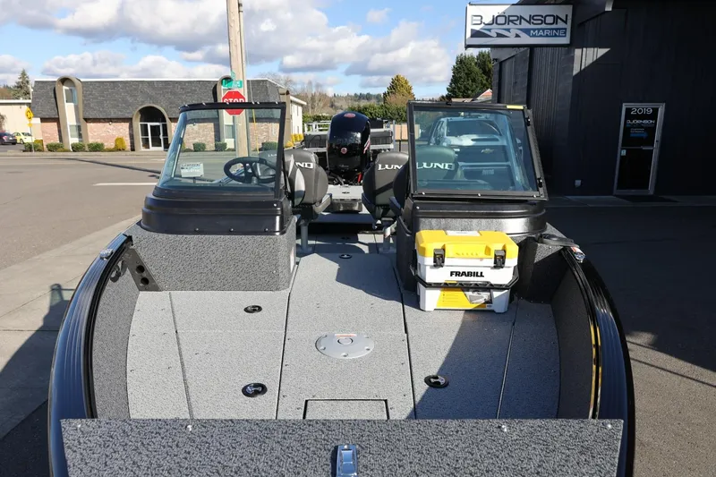 Slide: The Image of 2025 Lund 1875 Impact XS Sport boat at Bjornson Marine dealership. - 9