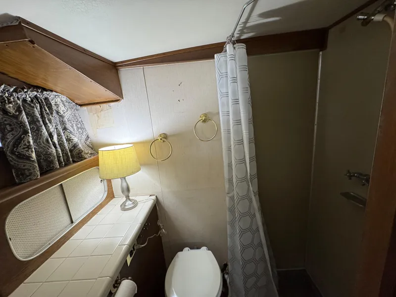 Slide: The Image of Bathroom interior of 1964 Chris-Craft Roamer 46 yacht with shower and lamp. - 27