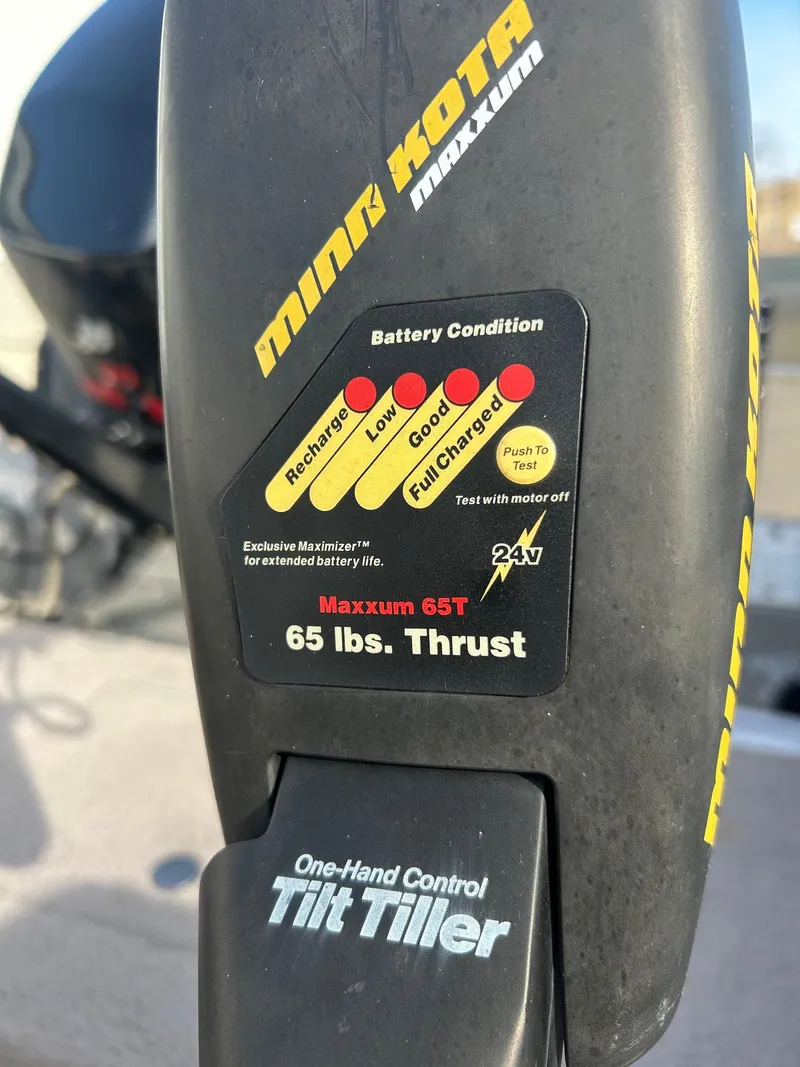 Slide: The Image of Minkota Maxxum trolling motor with battery condition indicator on Lund Pro Angler 16, 2002 model. - 14