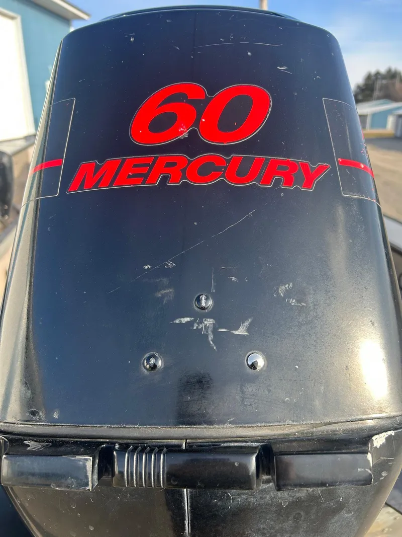 Slide: The Image of 2002 Lund Pro Angler 16 with 60 Mercury outboard motor, close-up view. - 4