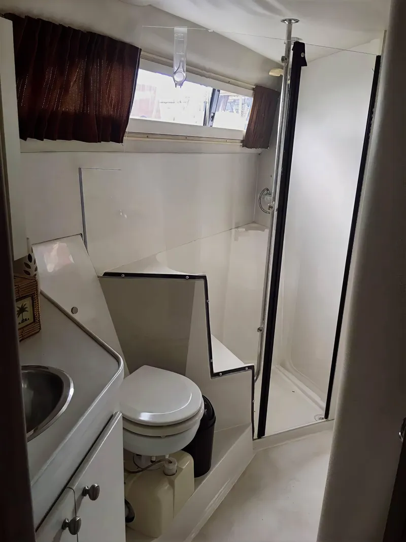 Slide: The Image of Bathroom interior of 1994 Carver 380 Santego yacht with shower and toilet. - 12