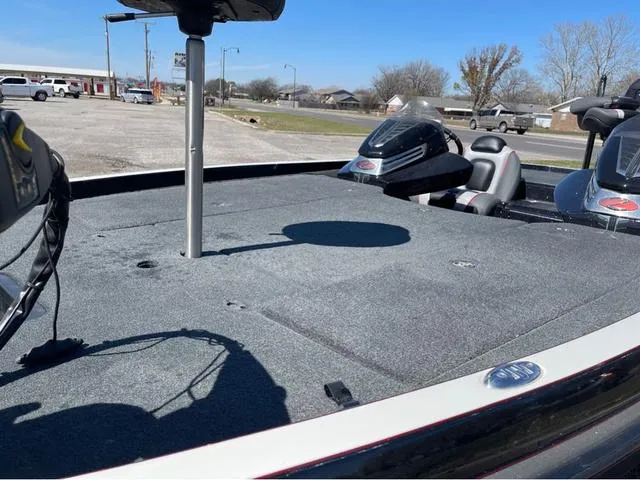 Slide: The Image of 2015 Ranger Z521C boat deck with seating and equipment, parked outdoors. - 11