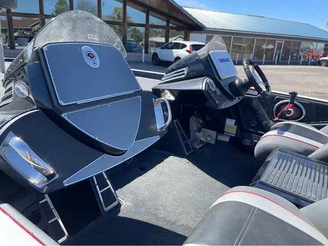 Slide: The Image of 2015 Ranger Z521C boat interior with dual consoles and seating. - 12