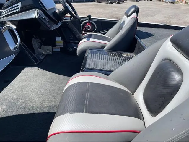 Slide: The Image of 2015 Ranger Z521C boat interior with black and gray seats, steering wheel, and dashboard. - 13