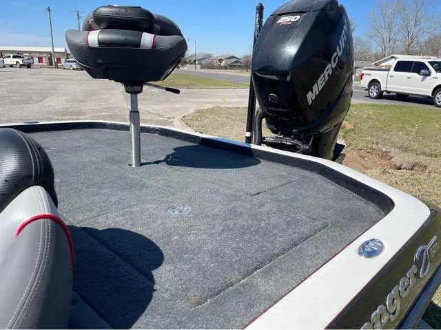 Slide: The Image of 2015 Ranger Z521C boat with Mercury engine, featuring a fishing seat and spacious deck. - 14