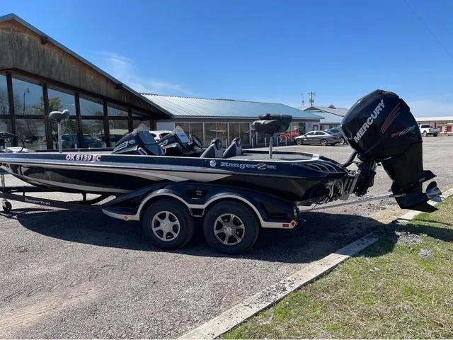 Slide: The Image of 2015 Ranger Z521C boat with Mercury engine parked outdoors. - 3