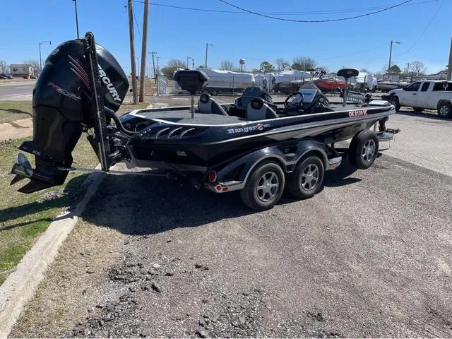 Slide: The Image of 2015 Ranger Z521C boat with Mercury engine on a trailer in a parking lot. - 4